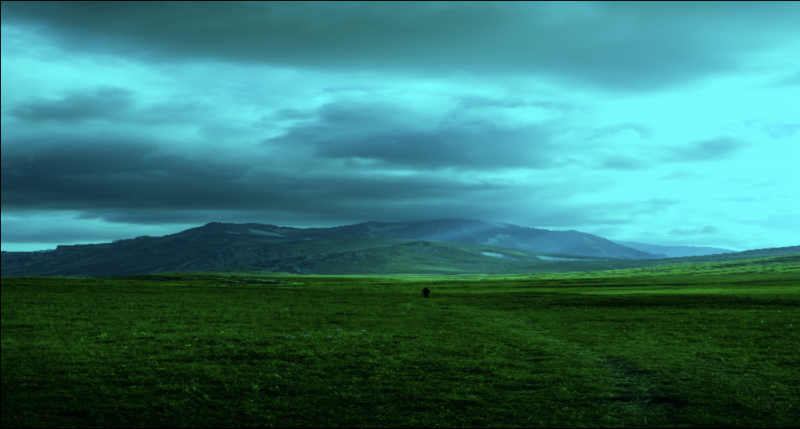 Edited photo of green grass field near mountain under white clouds by Gleb Lucky on pexels.com. The red color has been removed, resulting in light blue clouds and saturated green grass.