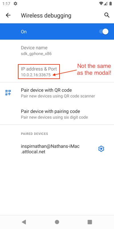 Wireless debugging page emphasizing a different IP address and port from modal