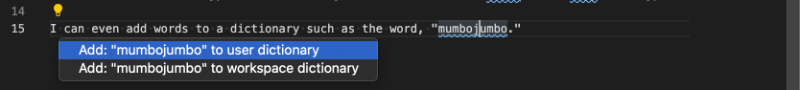 After clicking the light bulb icon, a popup appears with two options: add mumbojumbo to user dictionary, add mumbojumbo to workspace dictionary.